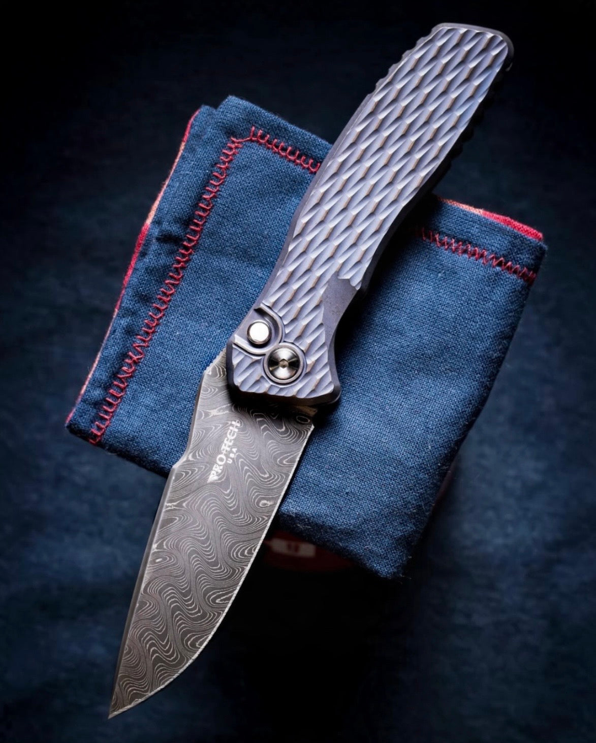ProTech x Spartan Blades (2026 Pallas Custom 005) Blade Show West 2026 Exclusive Pallas Auto - Distress Blue/Bronze Lattice Textured 6A14V Ti Handles - Chad Nichols Boomerang Demascus Blade - Black Lip Pearl Button - Satin Hardware /45