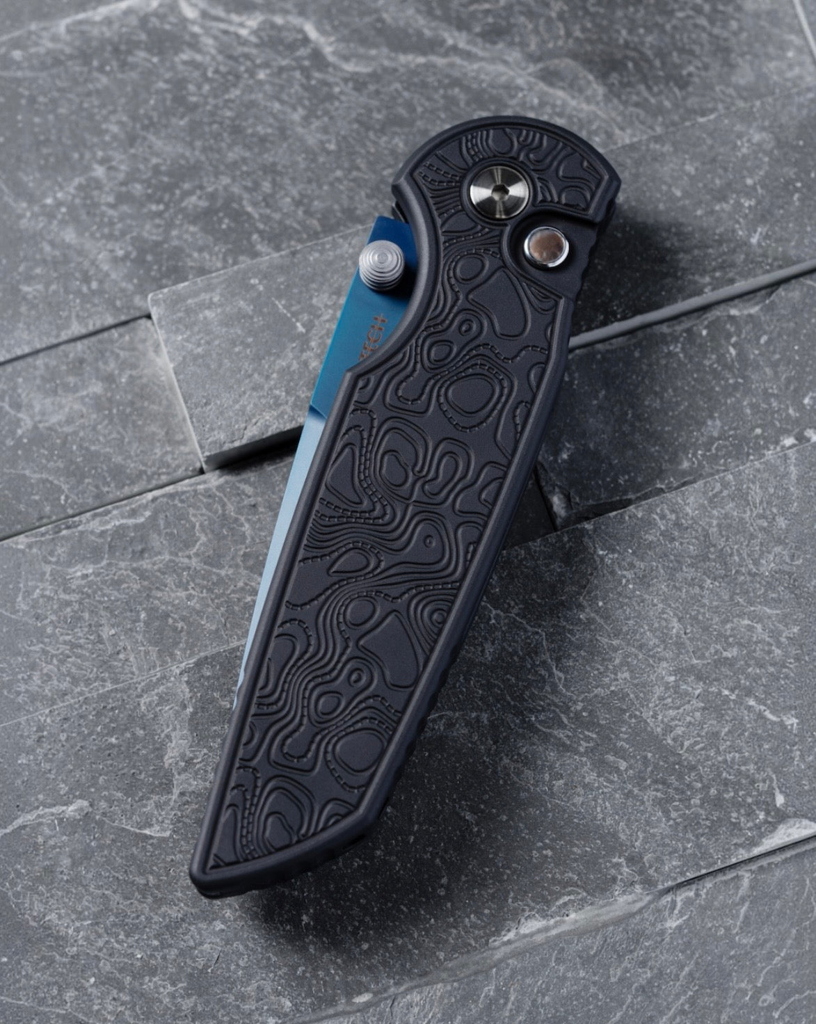 Pro-Tech CCKSF26.INT.1 CCKS Fall 2026 Exclusive TR-3 INTEGRITY Manual - Topographic Textured Black Handle - Denim PVD MAGNACUT Blade - Black Lip Pearl Button - Satin Hardware /80